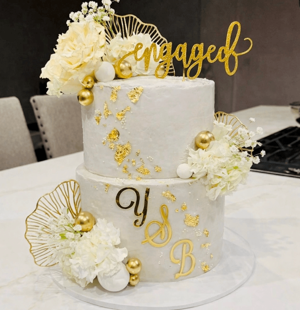 Custom engagement celebration cake with romantic floral decorations, crafted by Cakes by Ashni in New Jersey